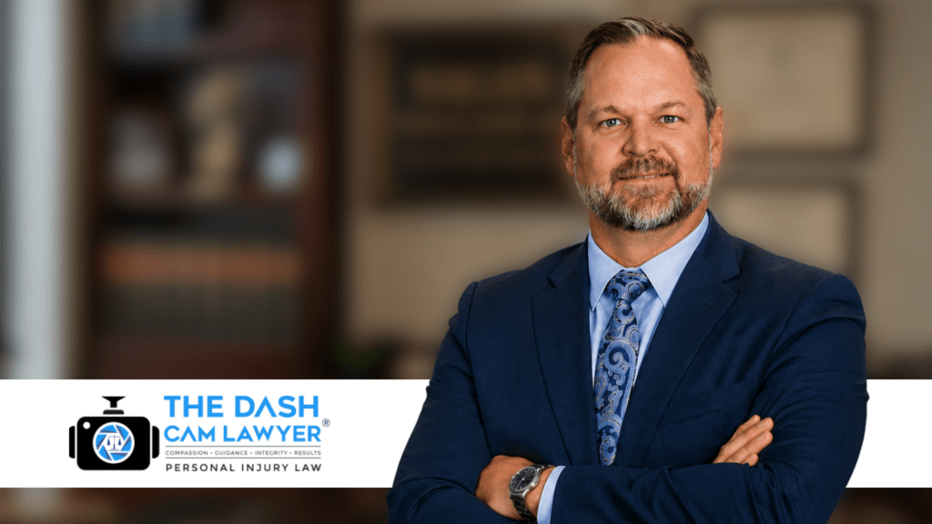 Professional lawyer in blue suit with arms crossed in office setting.