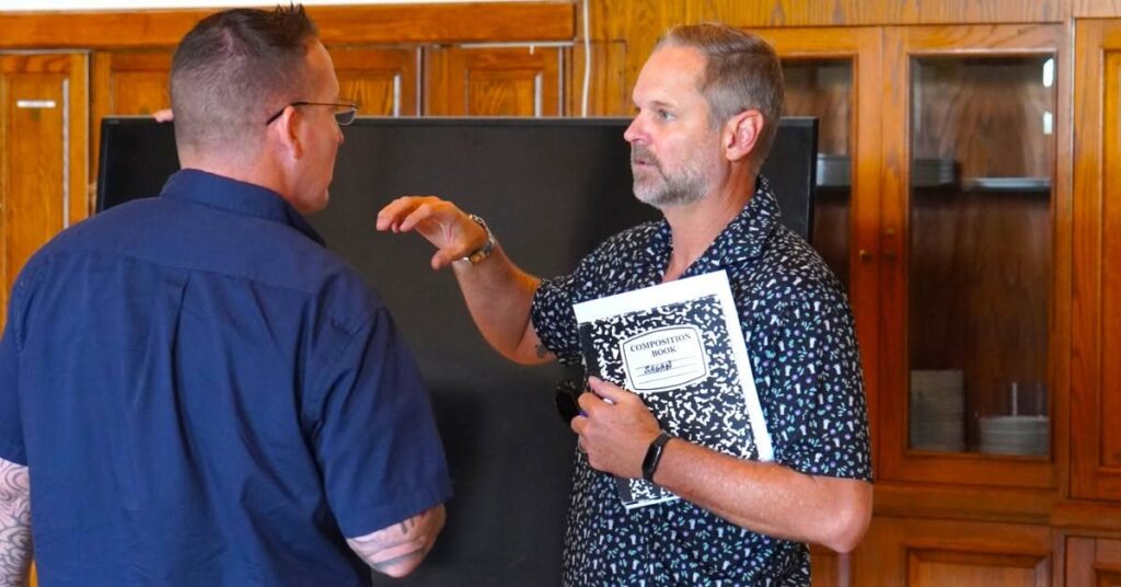 Shannon J. Sagan talking with a BNI Synergy member after the meeting
